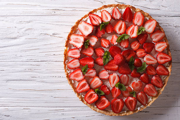 istock Delicious tart with fresh strawberries horizontal top view 495334024