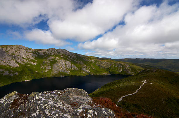 Overland Track, Tasmania The Overland Track is one of Australia's most famous bush walks, situated in the Cradle Mountain-Lake St Clair National Park, Tasmania. This is a part of the track, Marion's Lookout horizon over land stock pictures, royalty-free photos & images