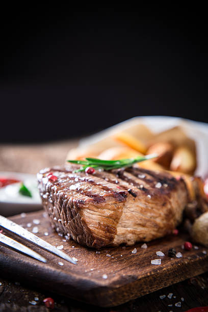 istock Beef steak on wooden table 495338649