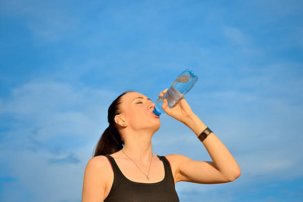 istock Woman drinking water from bottle 495340579