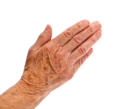 Elderly woman hand on an isolated background