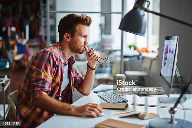 Serious Designer Stock Photo - Download Image Now - Design Professional, Desktop PC, Working