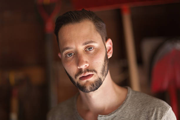istock Head and Shoulder Portrait of Young Man in Workshop 495341481