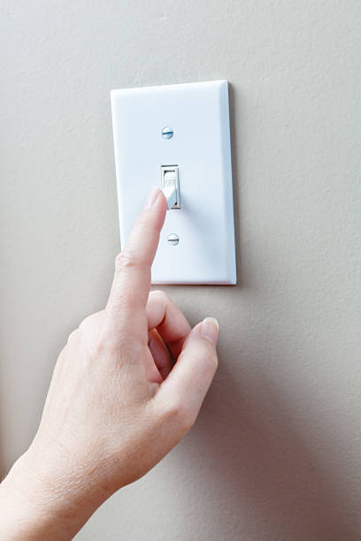 istock Conserving Eletricity Energy by Turning Off Light Switches 495341511