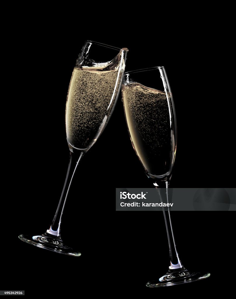 Cheers! Two champagne glasses Cheers! Two champagne glasses. Isolated on black background Champagne Stock Photo