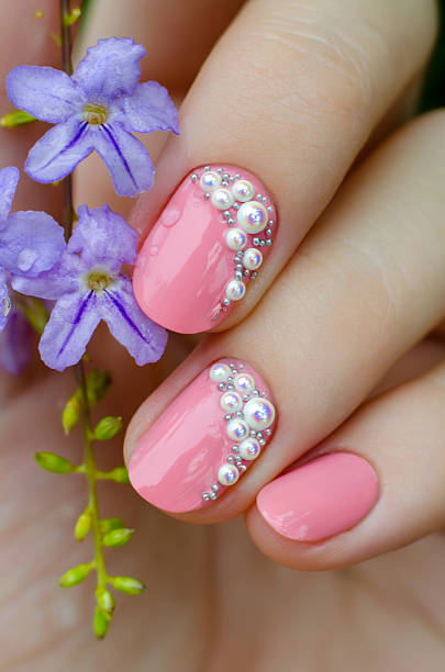 istock Pink manicure with mini pearls 495344598