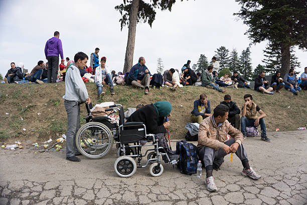 Syrian refugees Tovarnik, Сroatia - September 24, 2015: Syrian refugees on train station in Tovarnik, Croatia. Many refugees are crossing Croatia from Syria,Pakistan Afghanistan going to other countries of Europe as Germany,Austria,Denmark and others searching for better future for their families. Nobody wants to be refugee and no one of this people coming from this countries want to be, but they are running away to not be killed in any moment in Syria or Afghanistan. invalid person stock pictures, royalty-free photos & images
