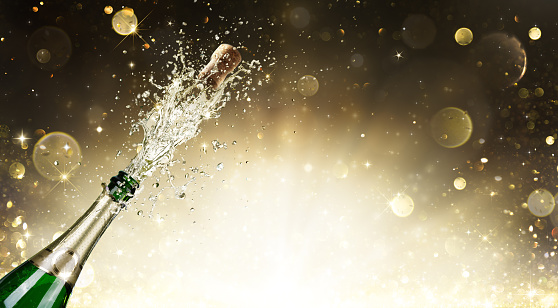 Champagne bottle with golden background