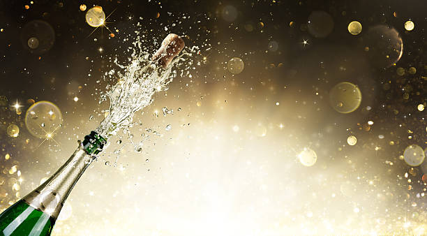 Champagne Explosion - Celebration New Year Champagne bottle with golden background soda photos stock pictures, royalty-free photos & images