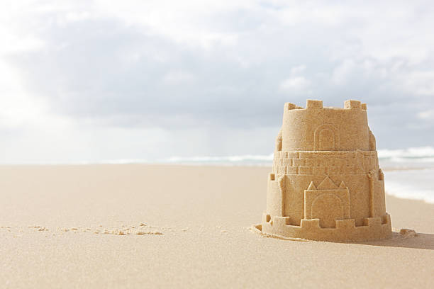 solitary sandcastle - sandburg struktur stock-fotos und bilder