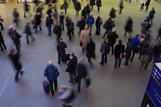 istock Blur Movement people in Rush Hour train station, London, UK 495352431