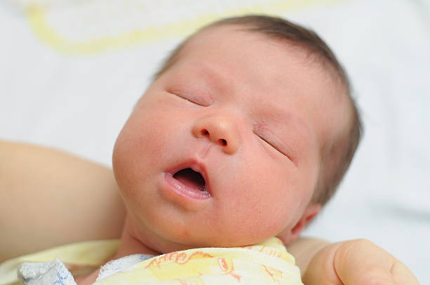 istock Baby sleeping with his mouth open 495353479