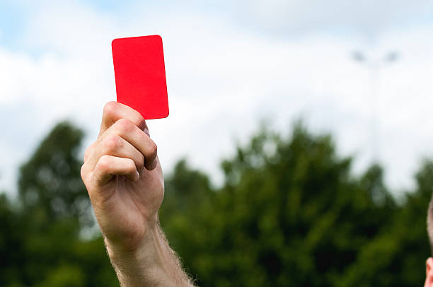 Referee shows a red card stock photo
