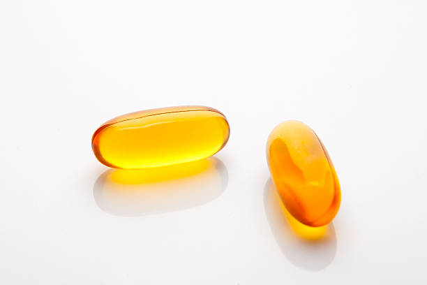 istock Vitamin fish oil capsule on white background 495353743