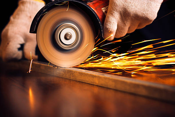 istock Red hot sparks at grinding steel material 495353779