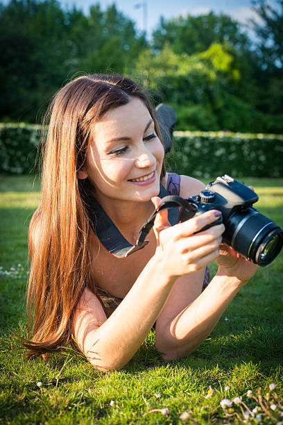 istock Girl with the camera in the park 495354033
