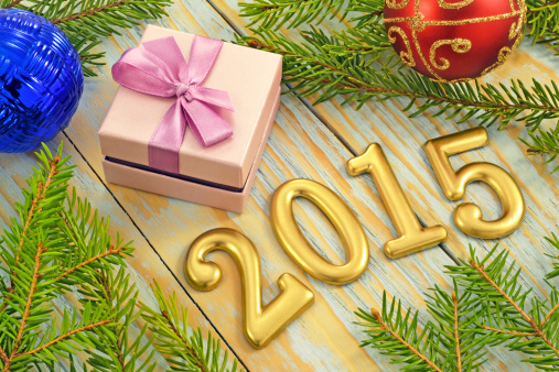 New Year decorations and gift on the background of fir branches