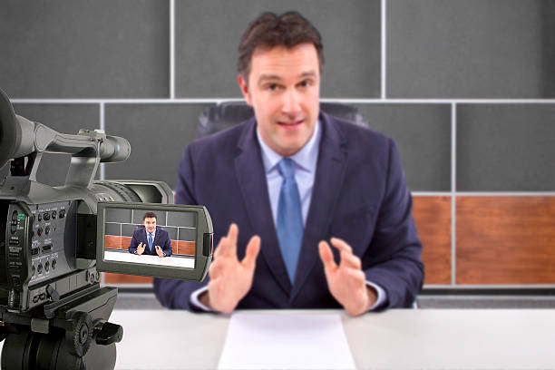 istock Camera Filming a Reporter or Anchorman in a Studio 495354441