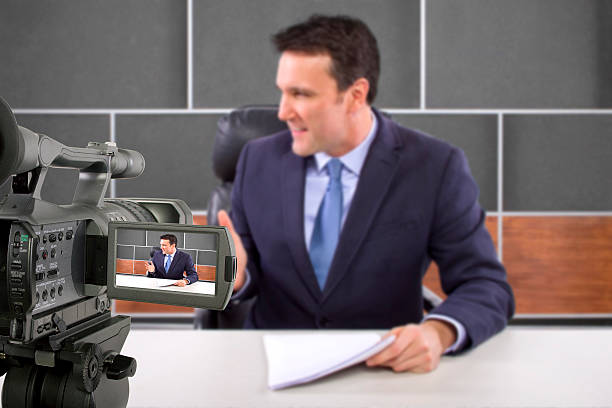 istock Camera Filming a Reporter or Anchorman in a Studio 495354443
