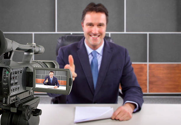 istock Camera Filming a Reporter or Anchorman in a Studio 495354465