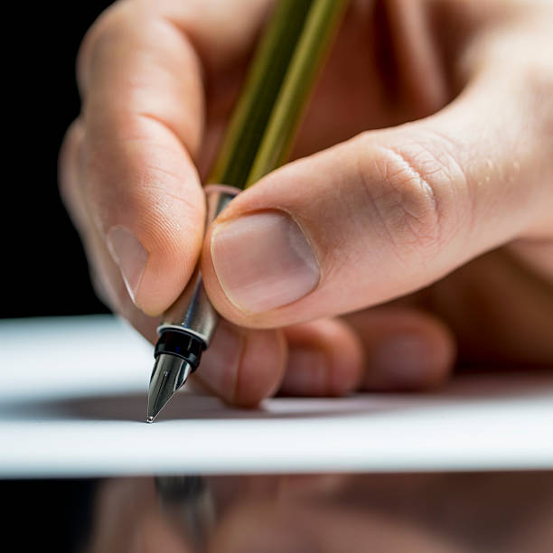 istock Man writing with a fountain pen 495355003