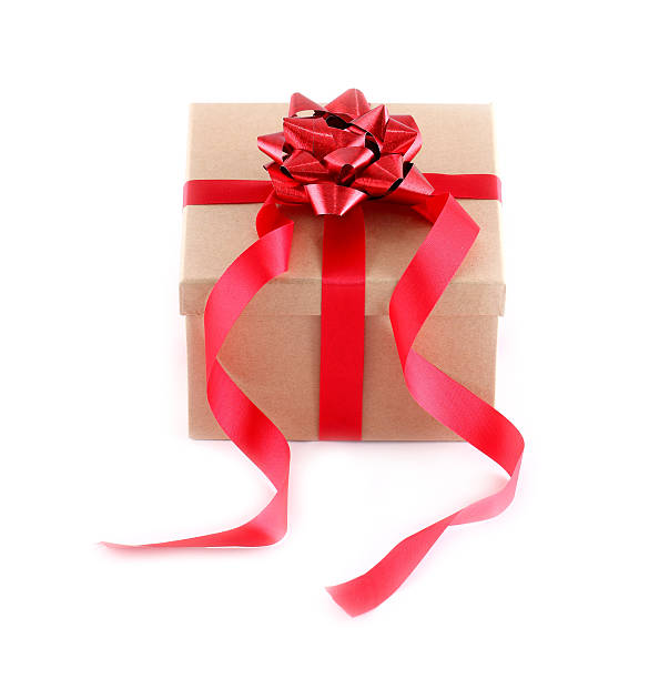istock Brown paper gift box with red ribbon bow on white 495355079