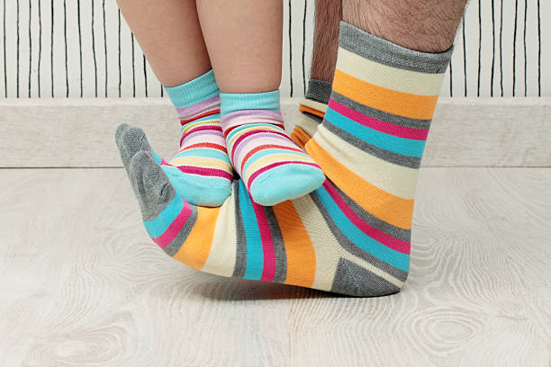 istock father and son in socks 495355595