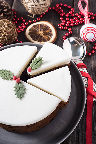 istock Christmas fruit cake on table with festive decorations 495356188