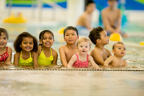 istock Children Lined Up in the Pool 495356410