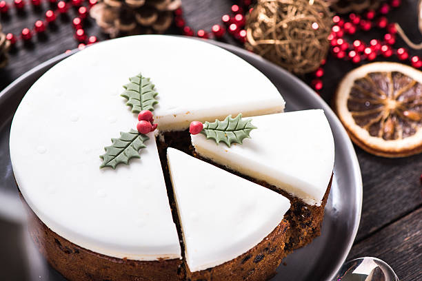 istock Christmas fruit cake on table with festive decorations 495356418