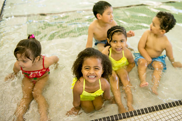 istock Happy Kids Swimming at the Pool 495357086