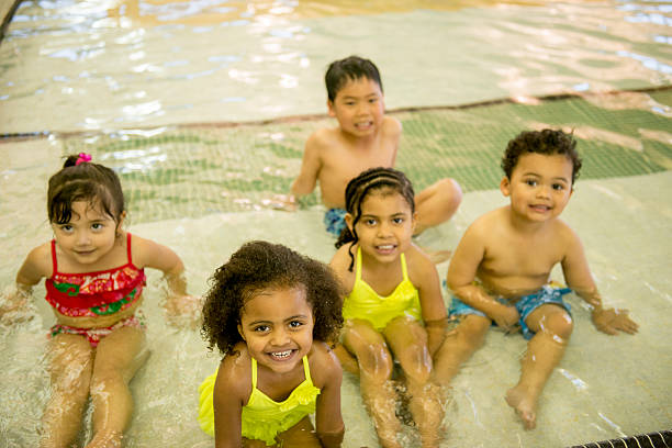 istock Little Kids Playing in the Pool 495357276