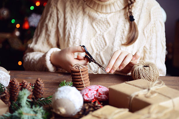 istock girl making Christmas presents 495359806