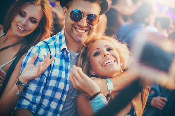 istock Three friends taking selfies at a party. 495370840