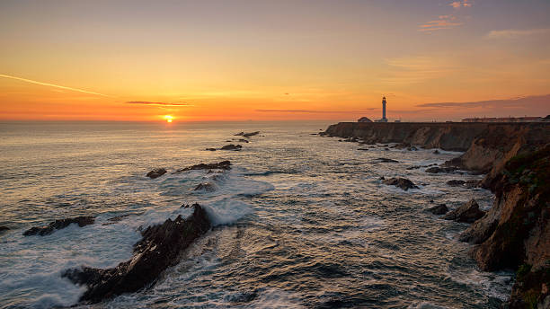 istock Point Arena Lighthouse with splashing surf at sunset, Pacific Ocean 495370992