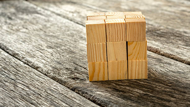 istock Cube assembled from 27 smaller wooden cubes 495371198