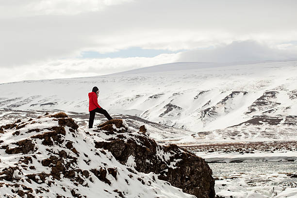 istock Hiker at mountain top of waterfall Godafoss 495372308