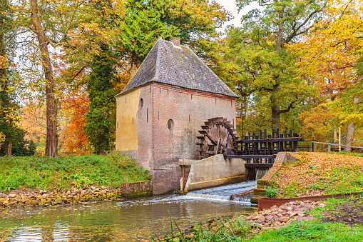 Old water mill in the Dutch province of Gelderland during autumn