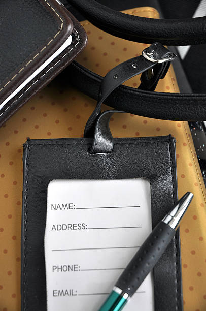 istock close up luggage tag with pen 495377234