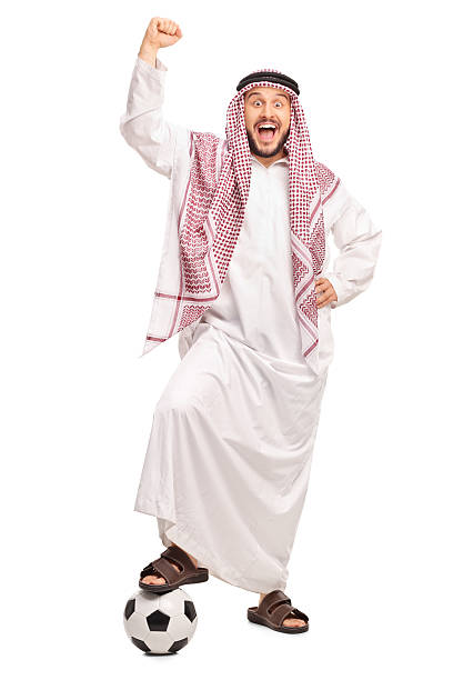istock Arab stepping over a football and gesturing happiness 495378248