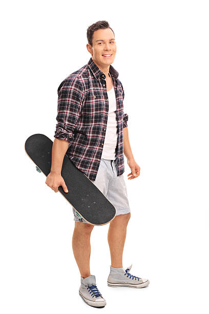 istock Young man holding a skateboard 495378358