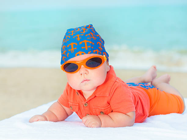 Baby on the beach stock photo