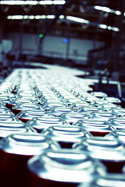 istock Cans on factory conveyer belt 495380949