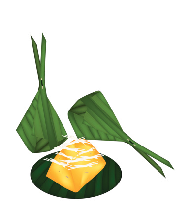 Thai Traditional Dessert, Freshly Homemade of Sweet Toddy Palm Cake with Coconut Wrapped in Banana Leaf Container.