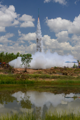 Space shuttle and launch rockets leave the Earth's atmosphere.