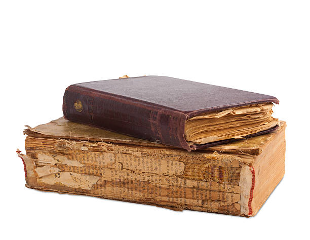 istock stack of old books with gold stamping on  white background 495385689