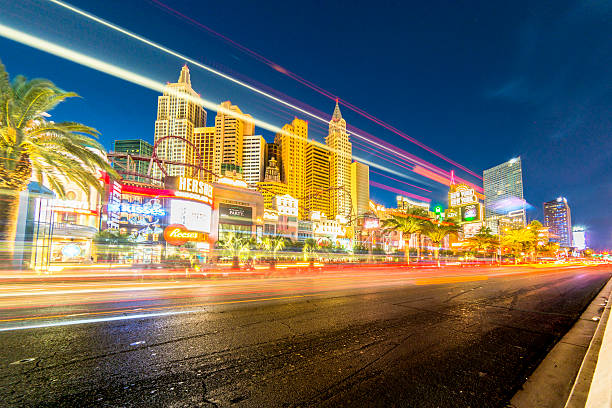 Las. Vegas. USA. 09.18.2023. Beautiful night view of the Strip with illuminated casino-hotel buildings and speeding cars against the backdrop of the dark sky.