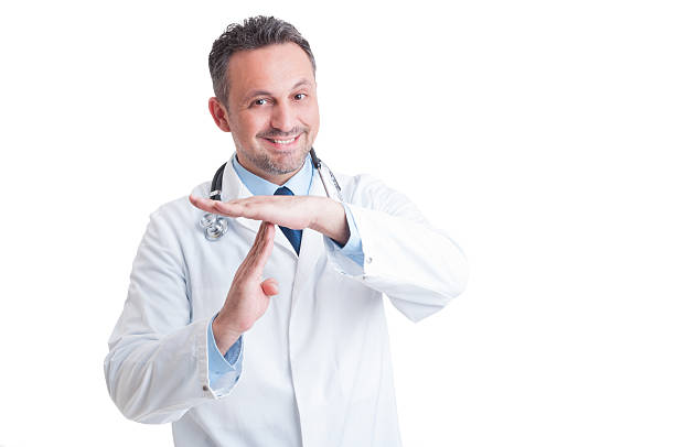 Smiling medic or doctor showing time out gesture Smiling medic or doctor showing time out gesture asking for break or pause isolated on white background time out signal stock pictures, royalty-free photos & images