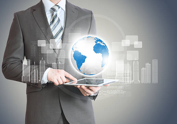 istock Businessman with tablet and planet 495389212