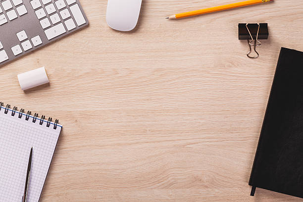 istock Top of desk with calendar, keyboard, mouse, notepad, pencil. 495392022